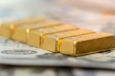 Gold retreats on strong dollar, delayed rate-cut expectations