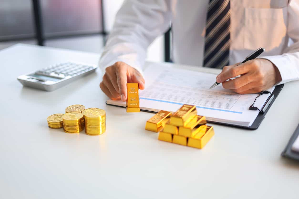 Gold falls on firm dollar, spotlight on Fed's rate decision.