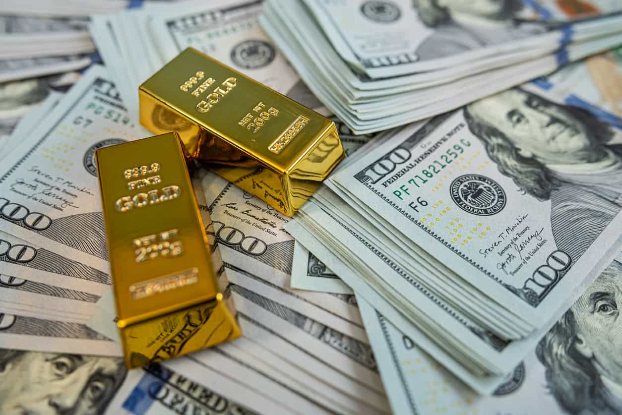 Gold slips but on track to snap four-month losing streak