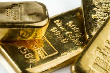 Gold eases from over two-month peak, inflation reports in focus