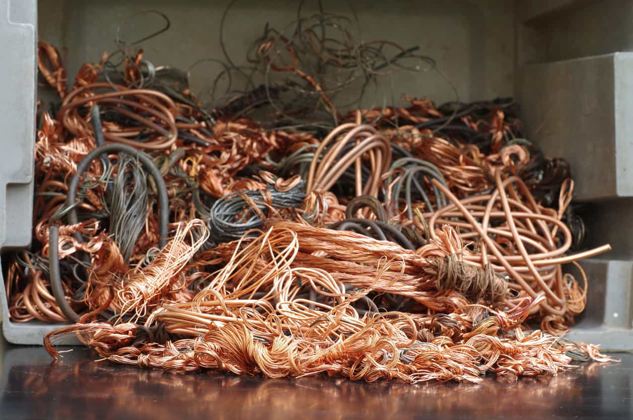 Copper steadies near three-week low amid easing LME tightness