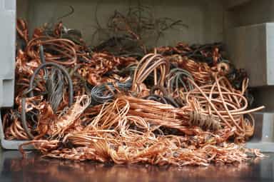 Copper steadies near three-week low amid easing LME tightness