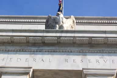 Gold slips as Fed officials signal rate hikes