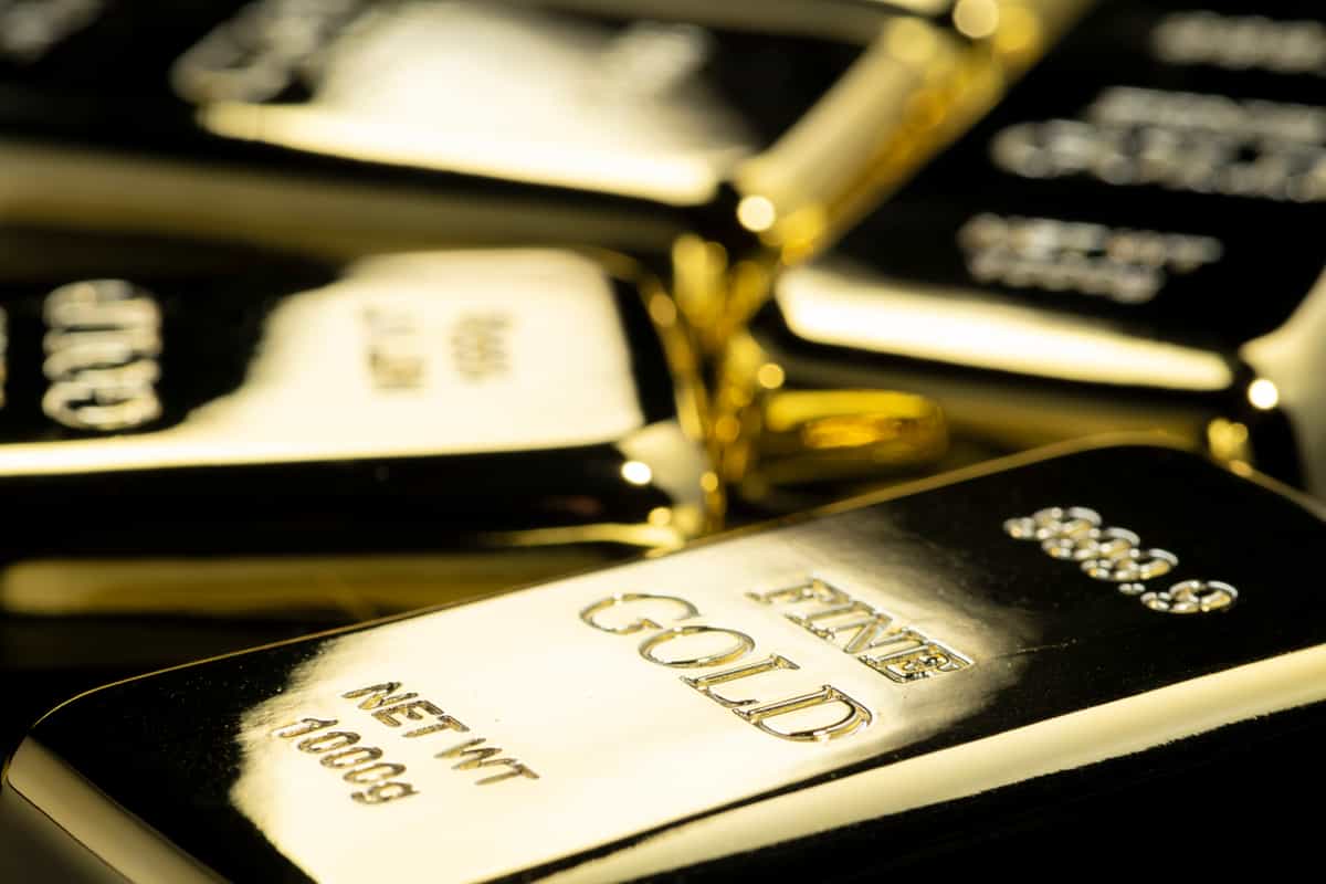Gold rises, but on track for weekly loss as Fed rate hike expectations build