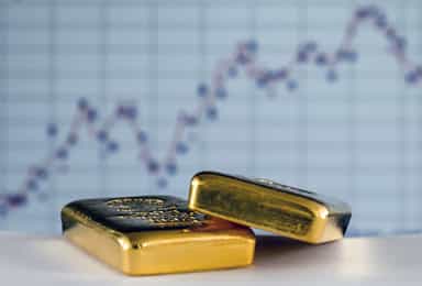Gold ticks up after hitting over 7-week low; US data in focus