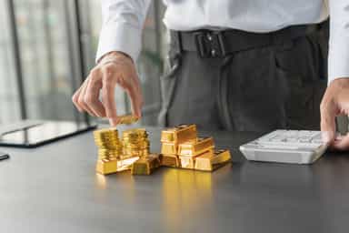 Gold slips from record high on profit-taking; key US data eyed
