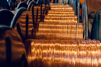 Copper gains as soft dollar set to save 10 week streak