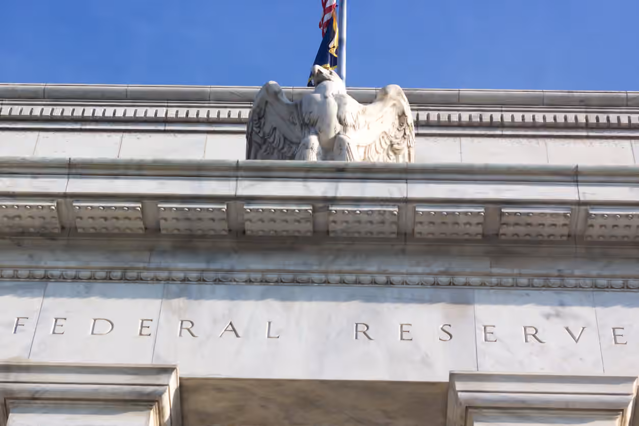 Gold slips as Fed officials signal rate hikes