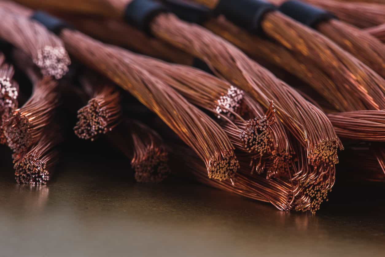 Copper crawls higher on softer dollar, but investors wary about demand