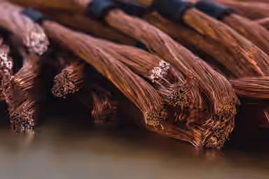 Copper crawls higher on softer dollar, but investors wary about demand