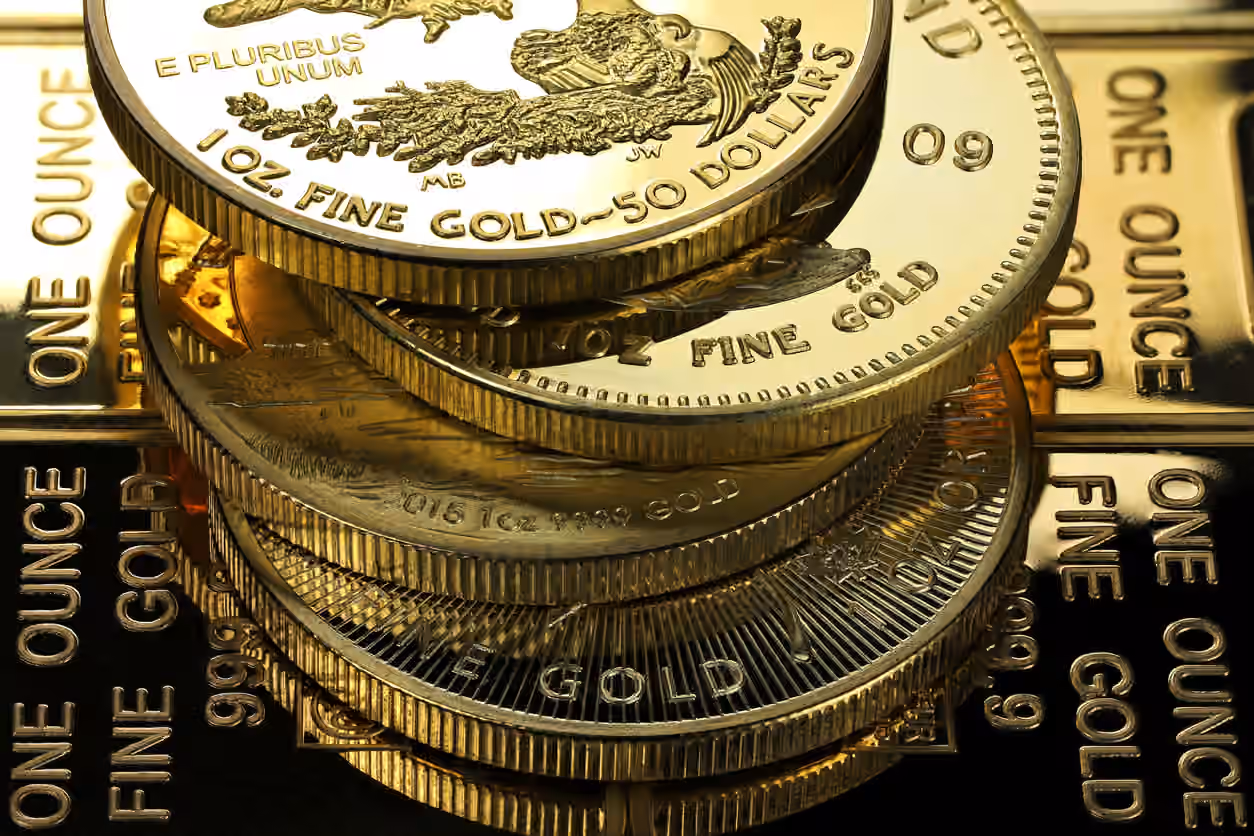Gold edges up as October rate hike bets ease, stronger dollar cap gains