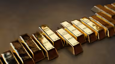 Gold rises as investors weigh Fed rate outlook, lower oil prices
